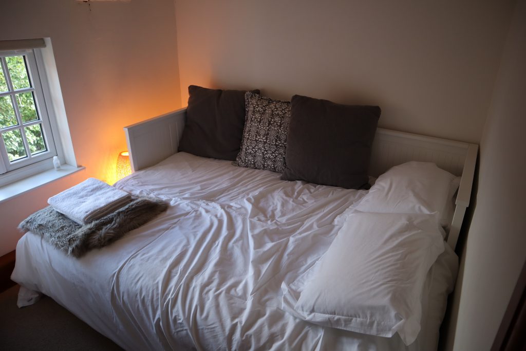 Cushions on the double bed in the cushion room